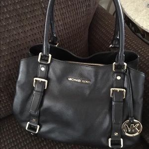 TWO MICHEAL KORS BAGS BARELY USED.